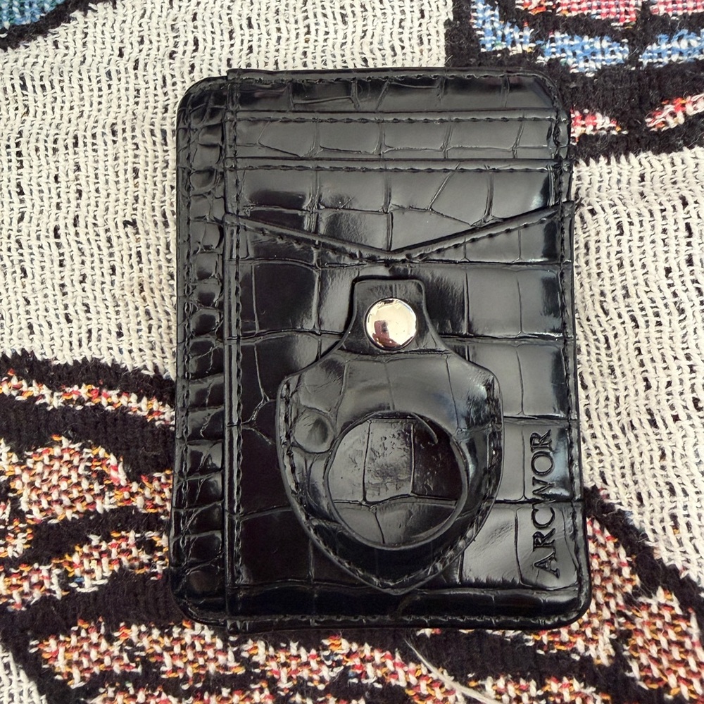 Black leather wallet with Apple tag clip
